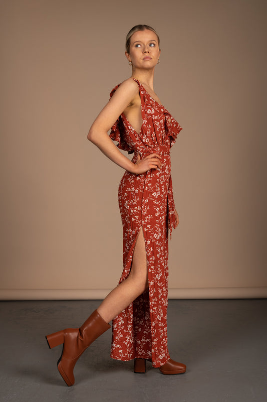 Vintage orange floral jumpsuit side view showing leg splits - Lemon Lane Vintage