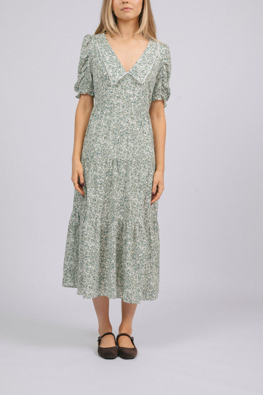 Vintage cottage core green floral tiered midi dress with lace trim, soft peter pan collar, and mid-length puff sleeves front view - Lemon Lane Vintage