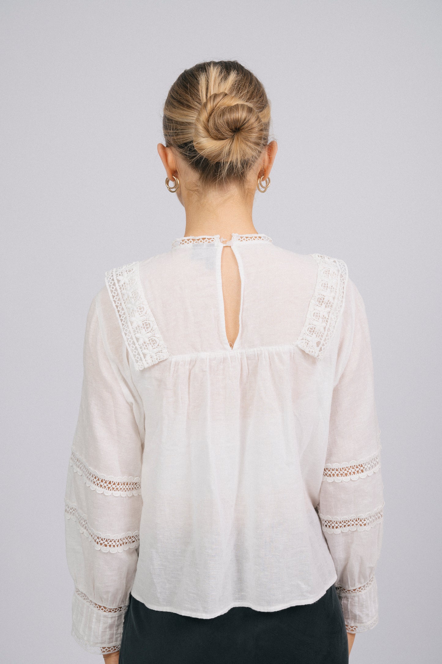 Vintage long sleeved white blouse lace detailing and fabric texture detail back view - Lemon Lane Vintage