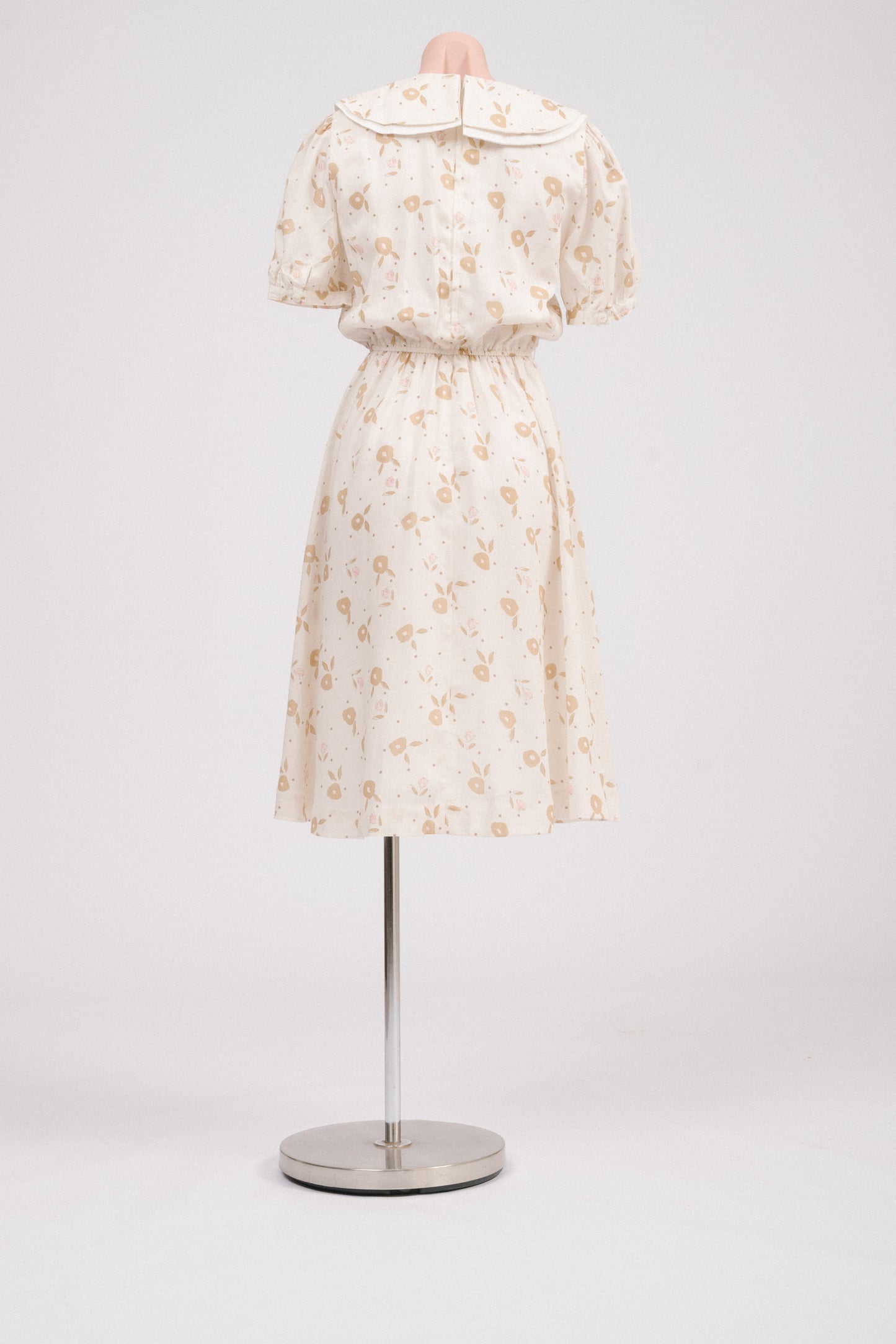 Back view showing lapped metal zipper on vintage floral midi dress.