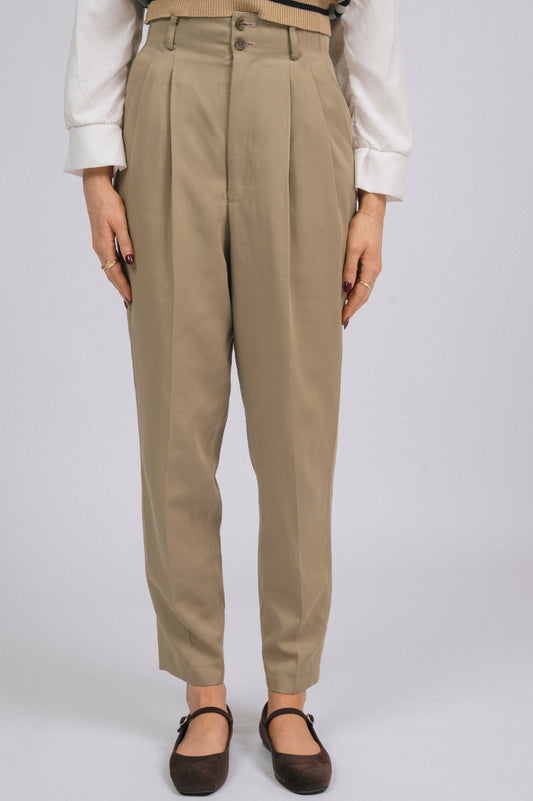 Vintage tailored high-waisted khaki green pants waistband, pockets, and button detail close-up - Lemon Lane Vintage