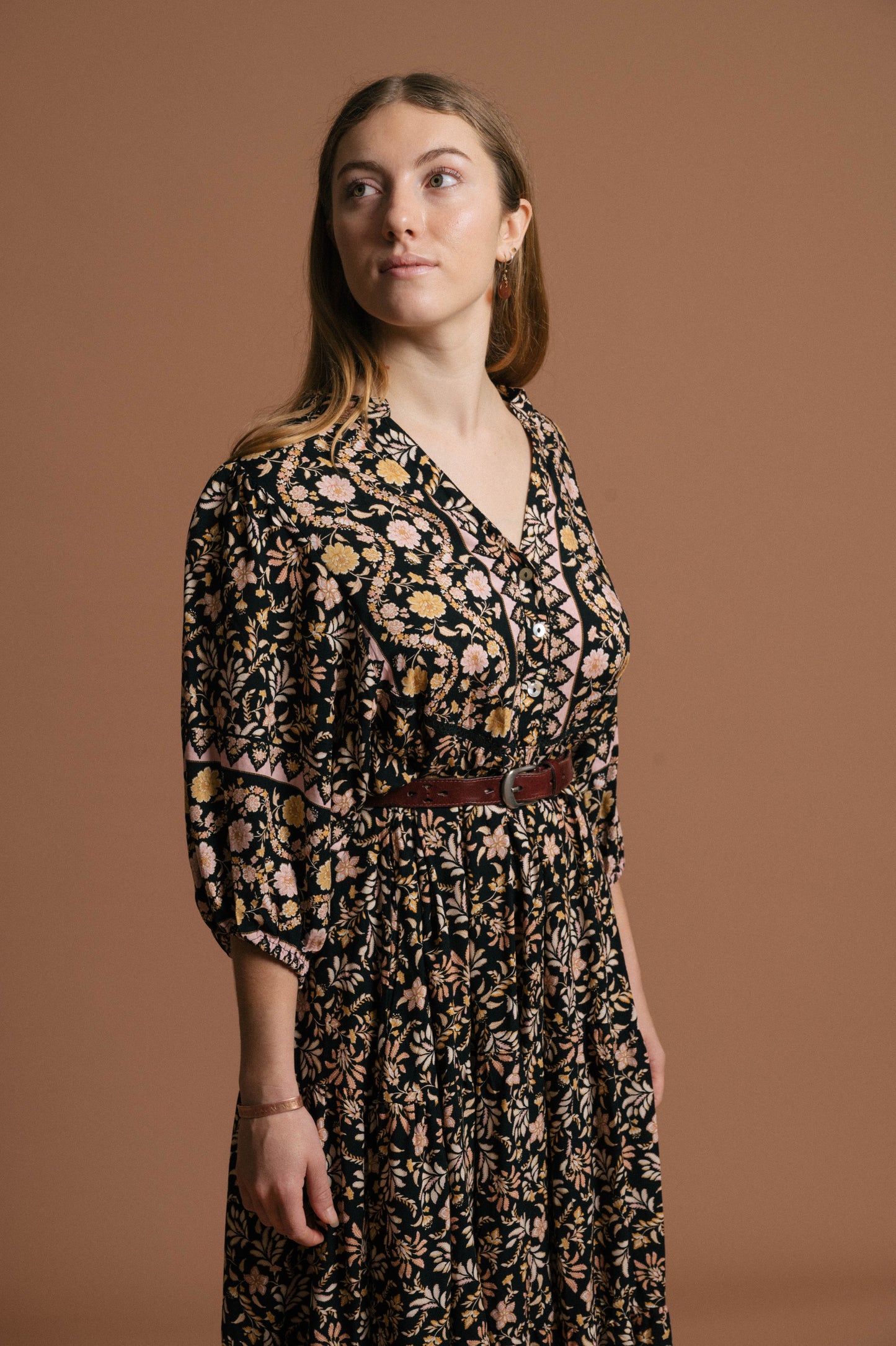 Vintage black floral midi dress floral pattern, fabric texture, and front button detail - Lemon Lane Vintage