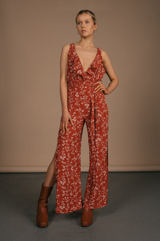 Vintage orange floral jumpsuit with spaghetti straps and ruffle collar front view - Lemon Lane Vintage