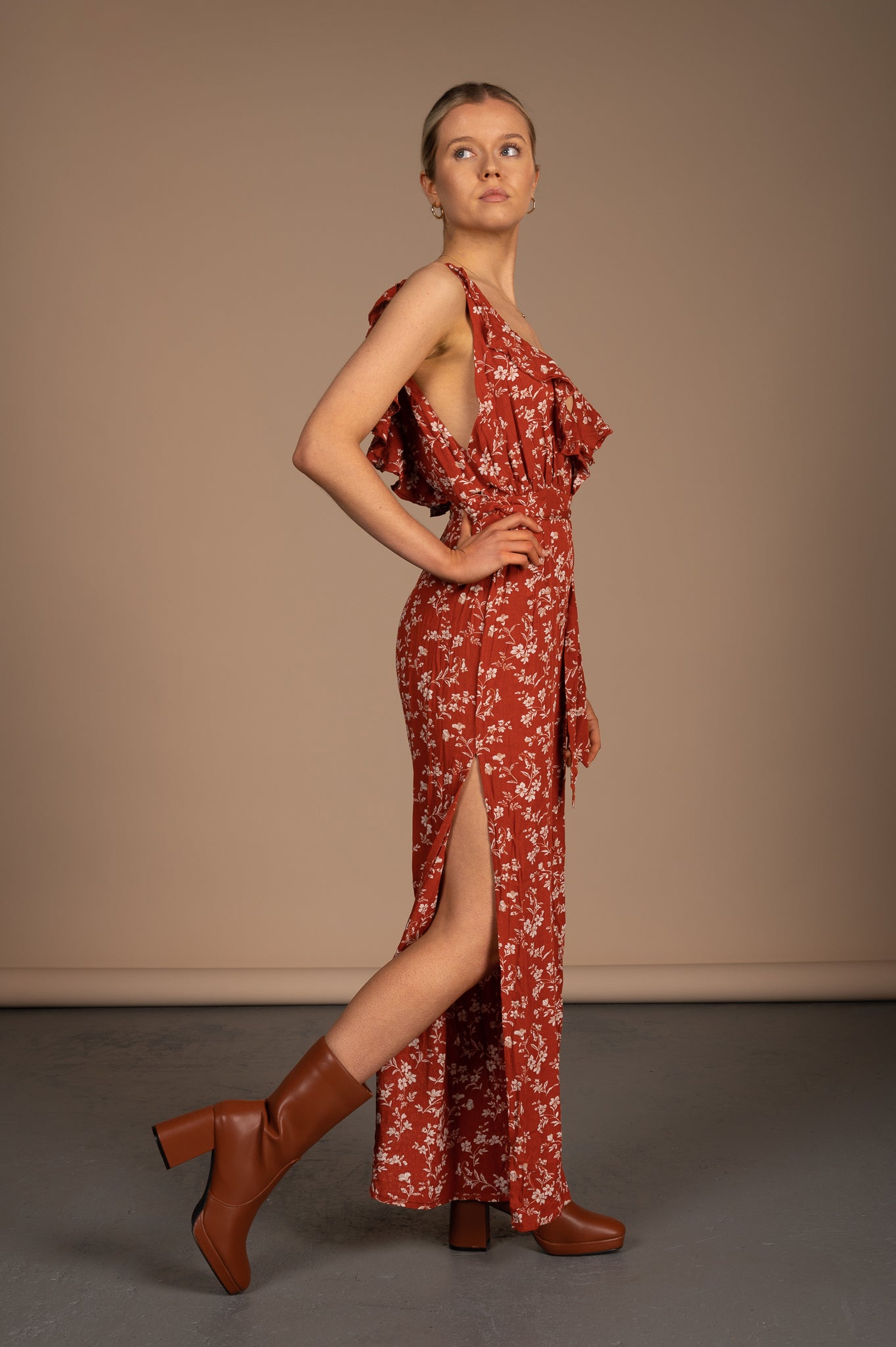 Vintage orange floral jumpsuit side view showing leg splits - Lemon Lane Vintage