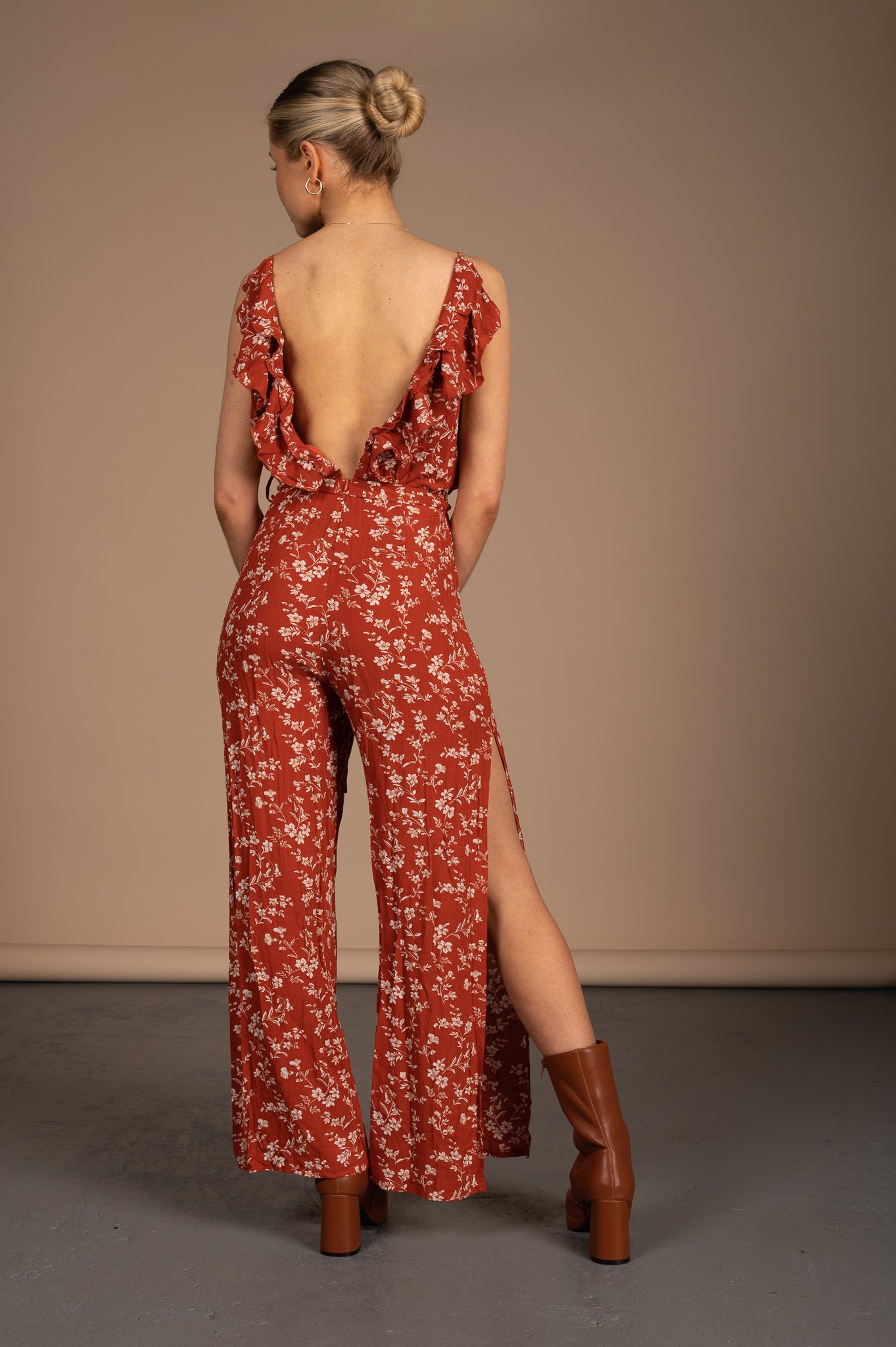 Vintage orange floral jumpsuit with spaghetti straps, ruffle collar, and low back detail back view - Lemon Lane Vintage