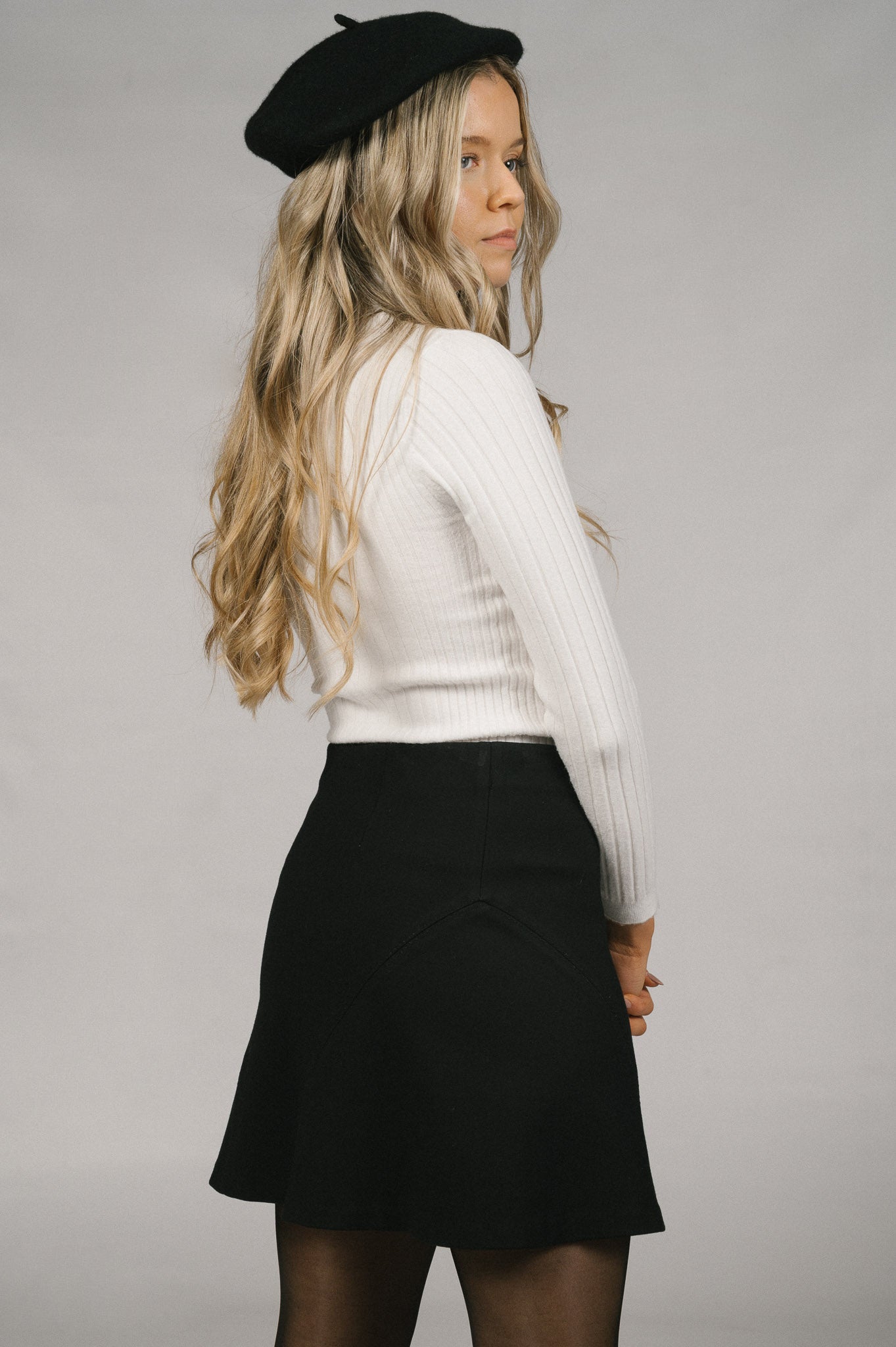 Vintage A-line black mini skirt back view - Lemon Lane Vintage