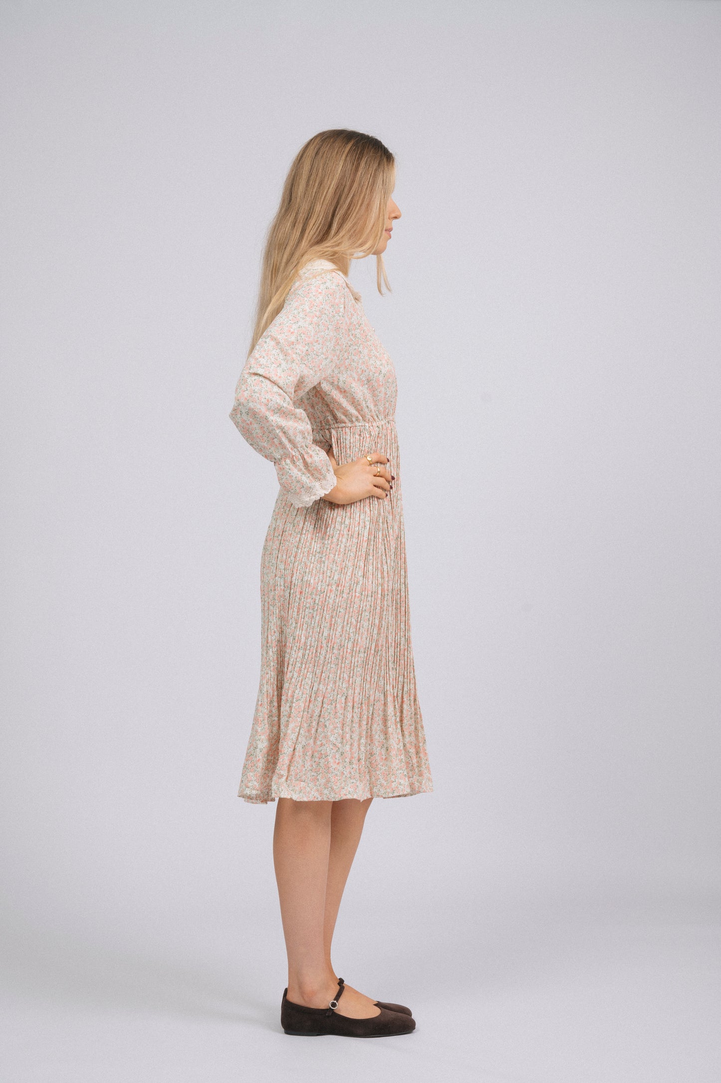 Vintage light pink 1940s-style floral long sleeved midi dress with lace trim, peter pan collar, bell sleeves, and front buttons cottage core prairie style side view - Lemon Lane Vintage