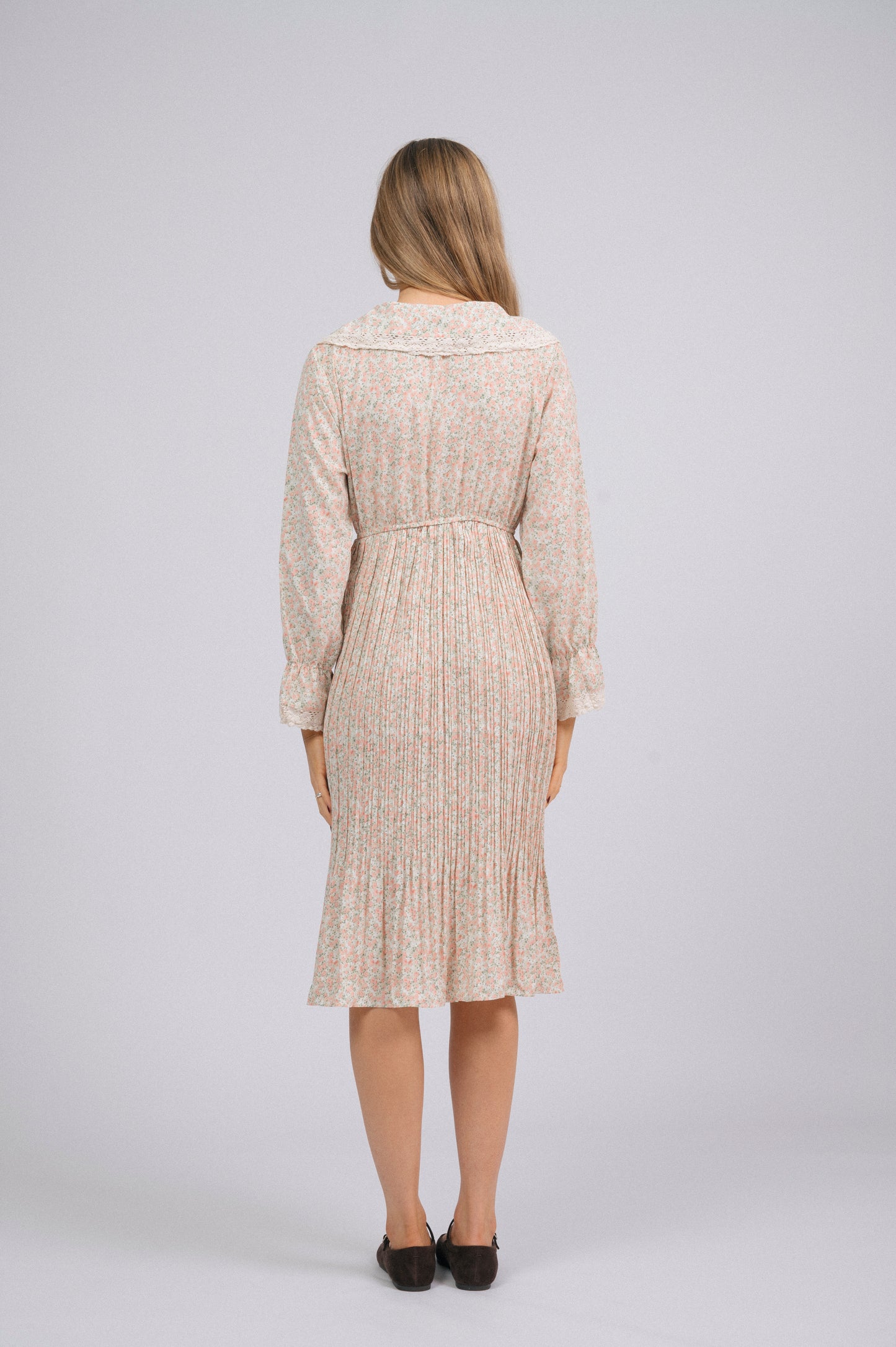 Vintage light pink 1940s-style floral long sleeved midi dress with lace trim, peter pan collar, bell sleeves, and front buttons cottage core prairie style back view - Lemon Lane Vintage