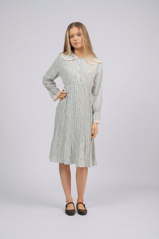 Vintage light blue 1940s-style floral long sleeved midi dress with lace trim, peter pan collar, bell sleeves, and front buttons cottage core prairie style front view - Lemon Lane Vintage