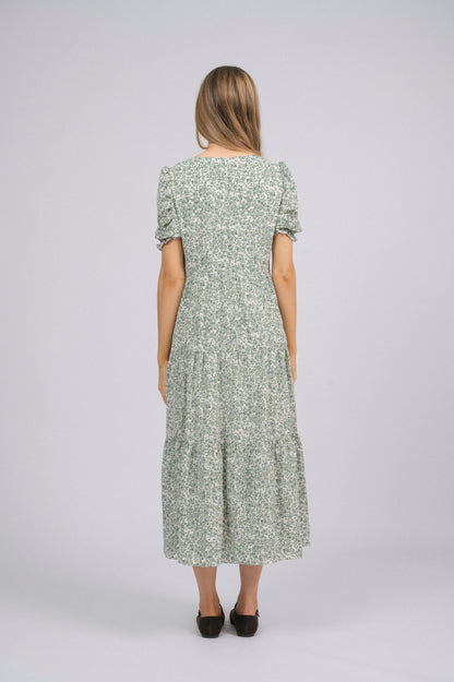 Vintage cottage core green floral tiered midi dress with lace trim, soft peter pan collar, and mid-length puff sleeves back view - Lemon Lane Vintage