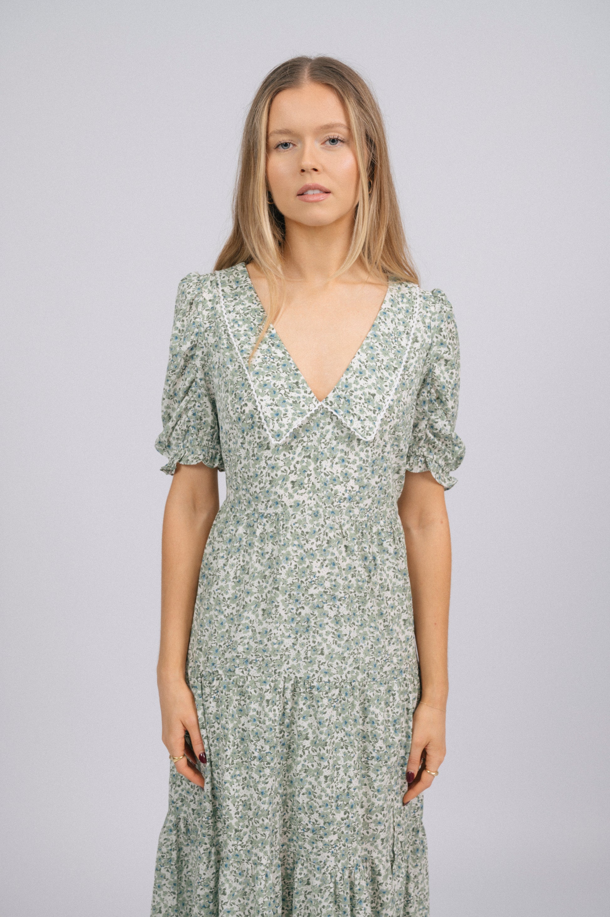 Vintage cottage core green floral tiered midi dress lace trim, soft peter pan collar, and floral fabric texture detail - Lemon Lane Vintage
