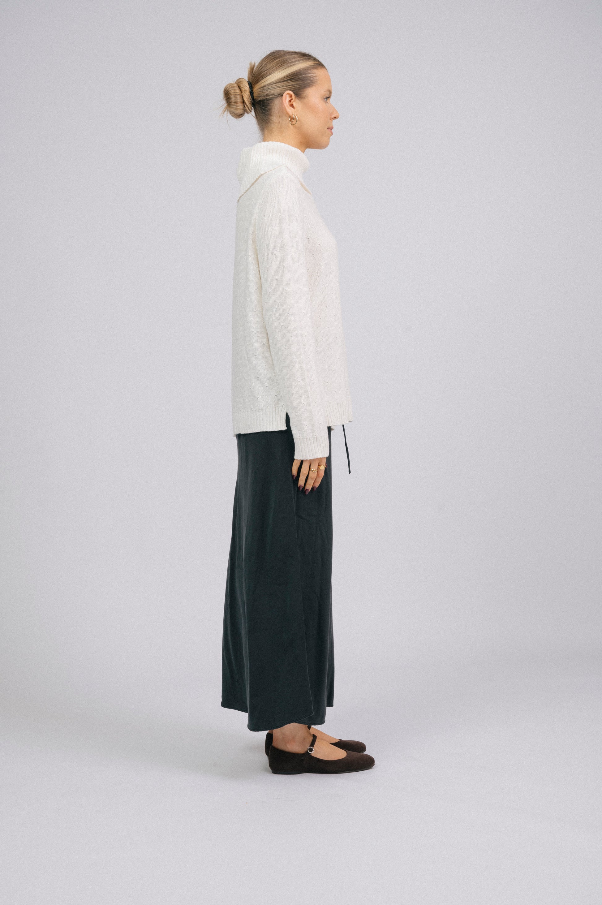 Vintage white knit turtleneck long sleeved top with ribbed trim and delicate stitch detail side view - Lemon Lane Vintage