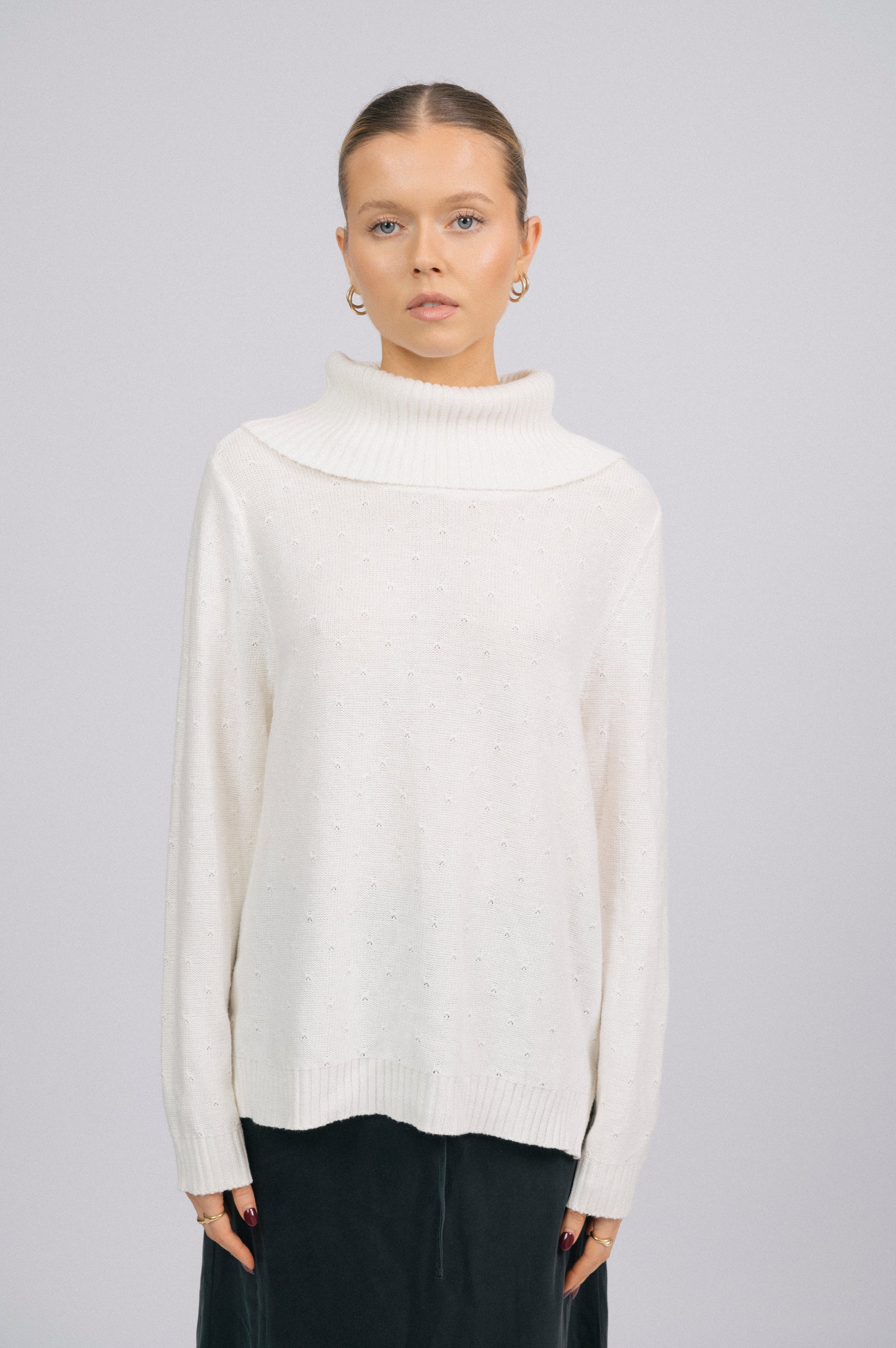 Vintage white knit long sleeved turtleneck top with ribbed trim and delicate stitch detail front view - Lemon Lane Vintage
