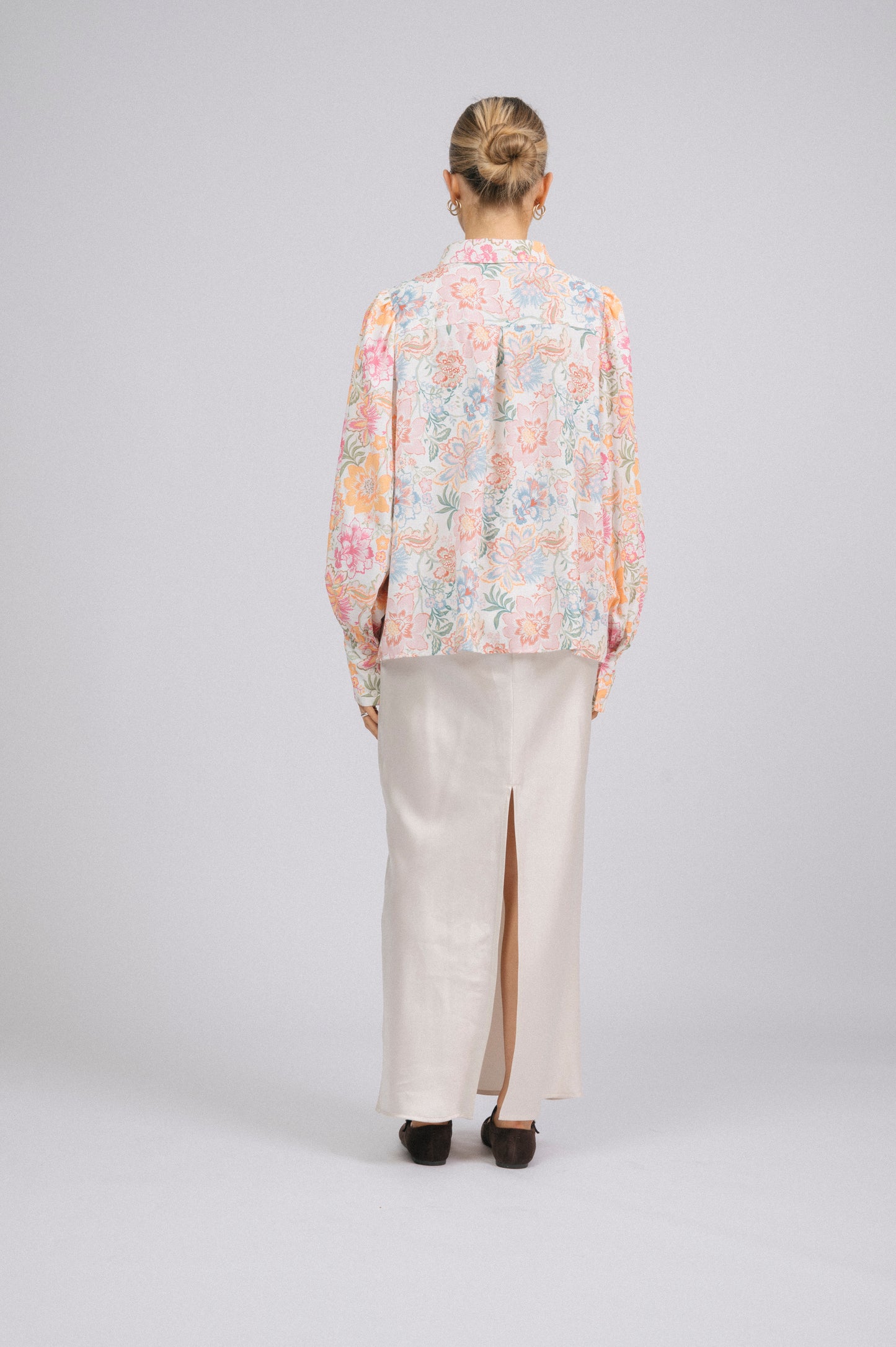 Vintage white floral long sleeved button-up collared shirt with puffy sleeves back view - Lemon Lane Vintage