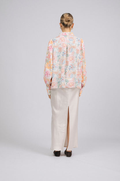 Vintage white floral long sleeved button-up collared shirt with puffy sleeves back view - Lemon Lane Vintage