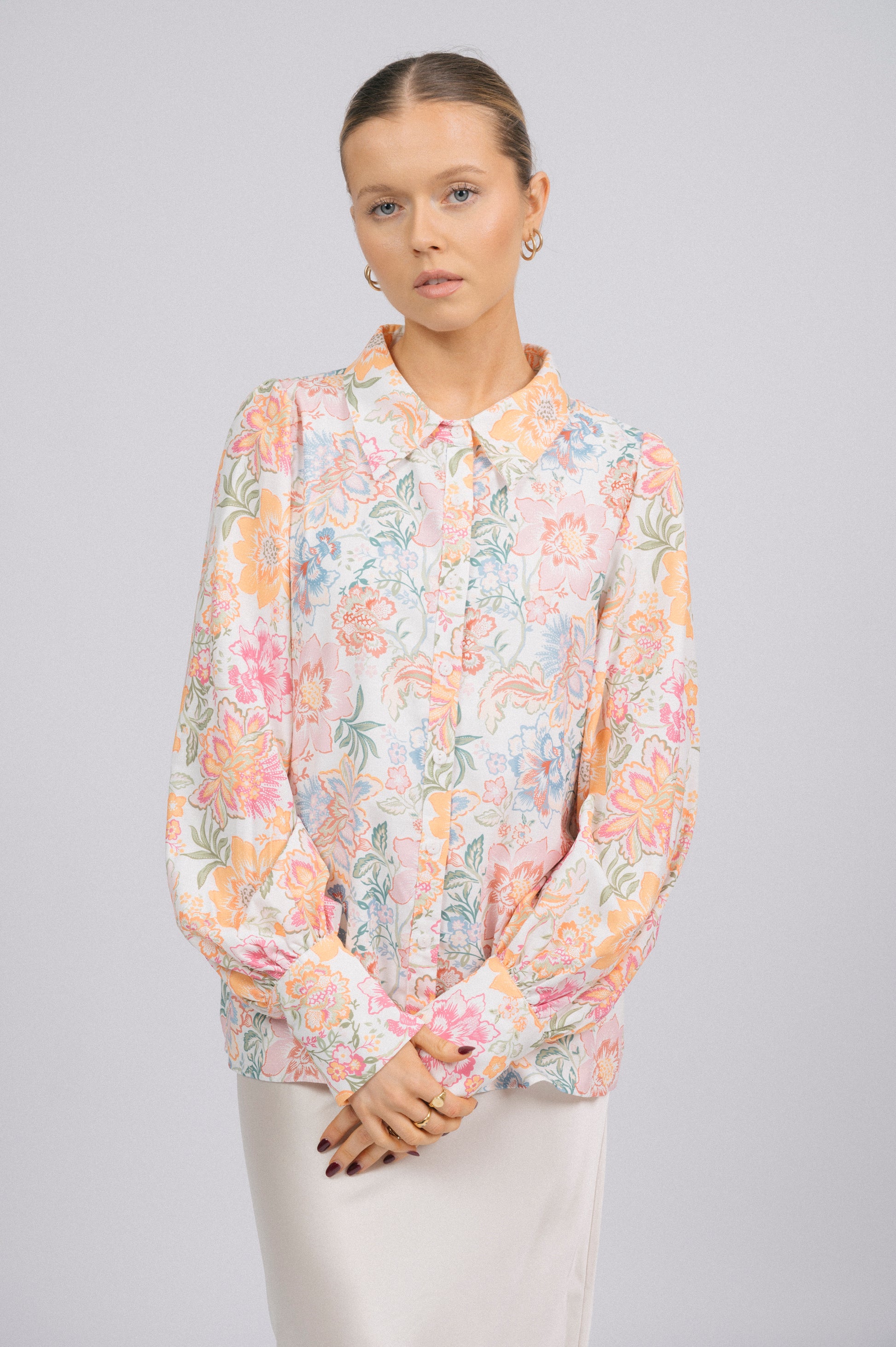Vintage white floral long sleeved button-up collared shirt floral pattern, buttons, and fabric texture detail - Lemon Lane Vintage