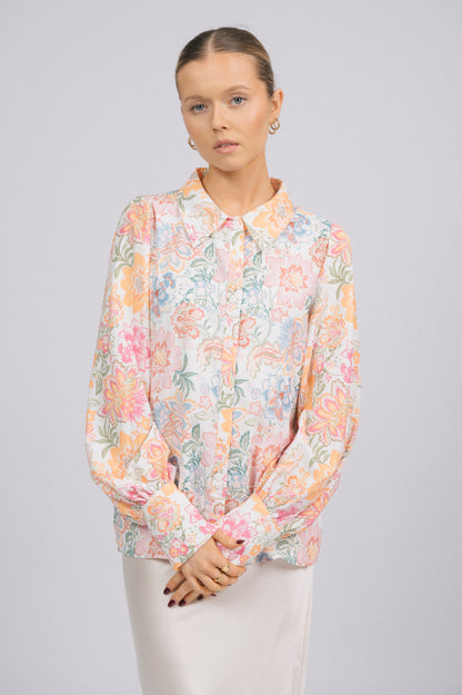 Vintage white floral long sleeved button-up collared shirt floral pattern, buttons, and fabric texture detail - Lemon Lane Vintage
