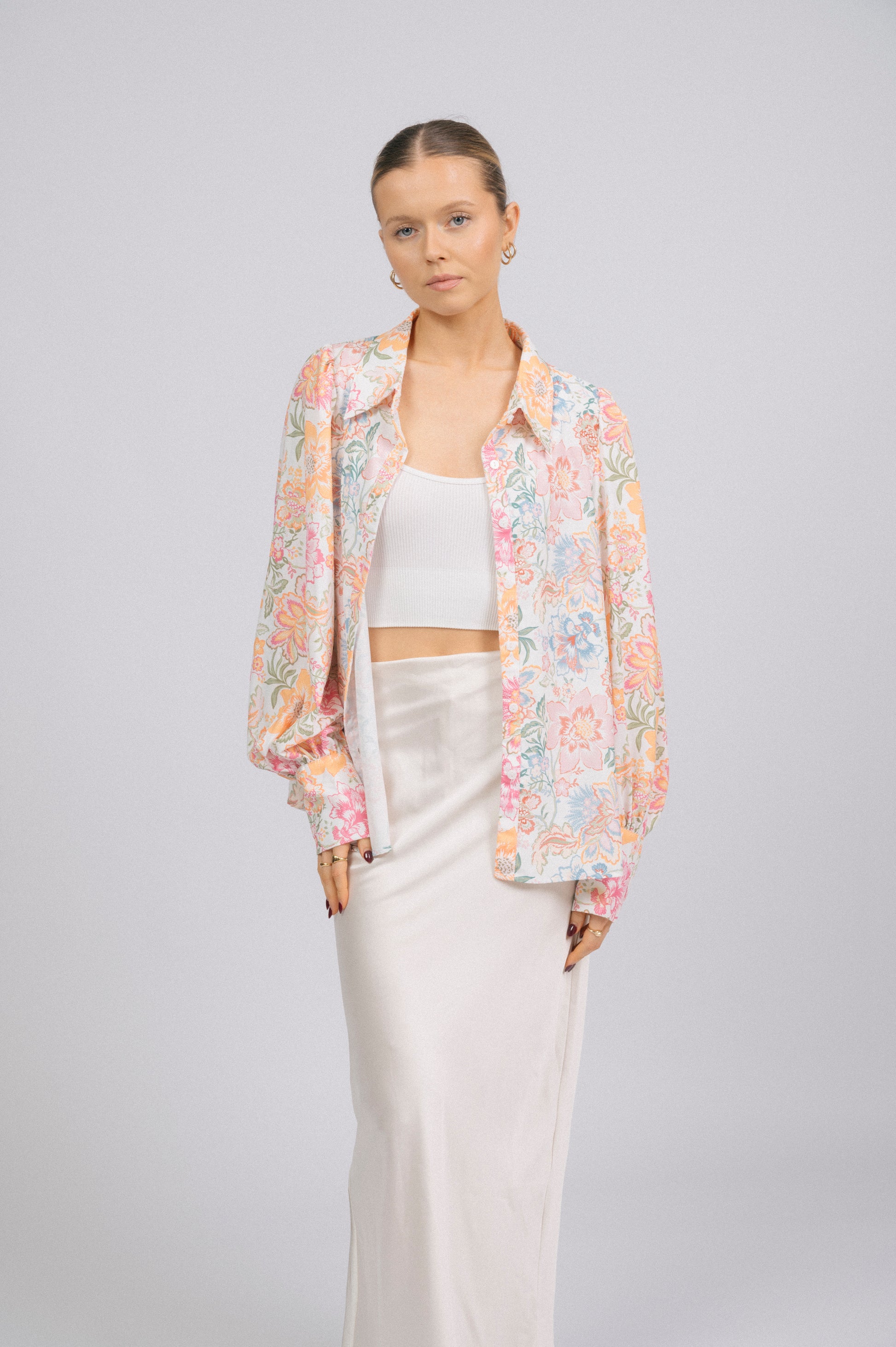 Vintage white floral long sleeved button-up collared shirt collar, puffy sleeves, and cuff detail - Lemon Lane Vintage