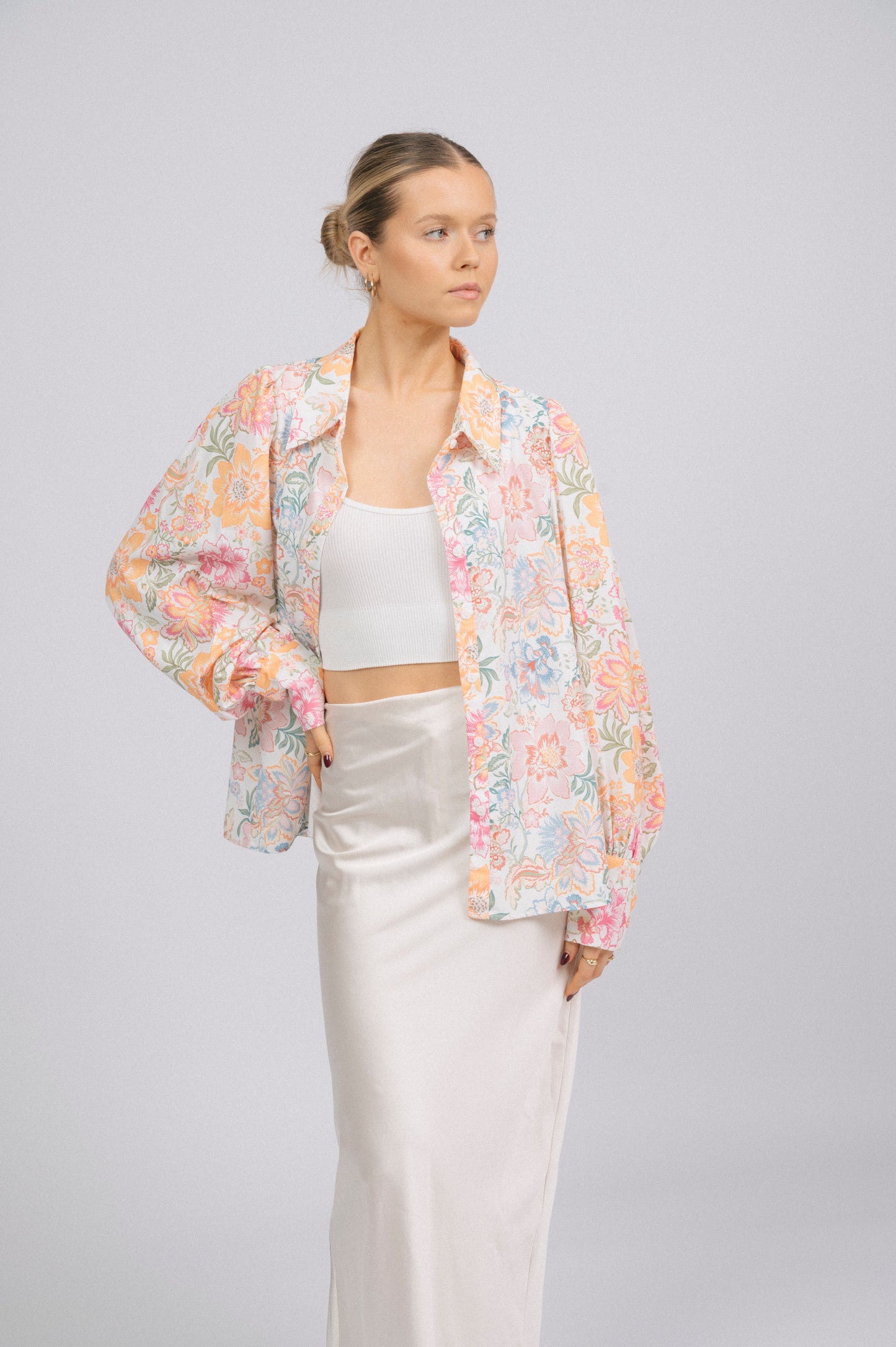 Vintage white floral long sleeved button-up collared shirt collar, puffy sleeves, and cuff detail - Lemon Lane Vintage