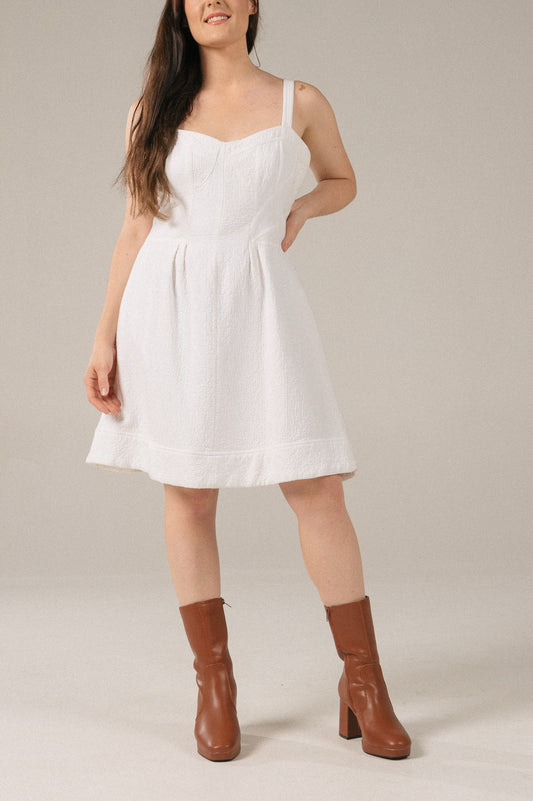 Vintage white A-line bustier mini dress with pockets front view - Lemon Lane Vintage