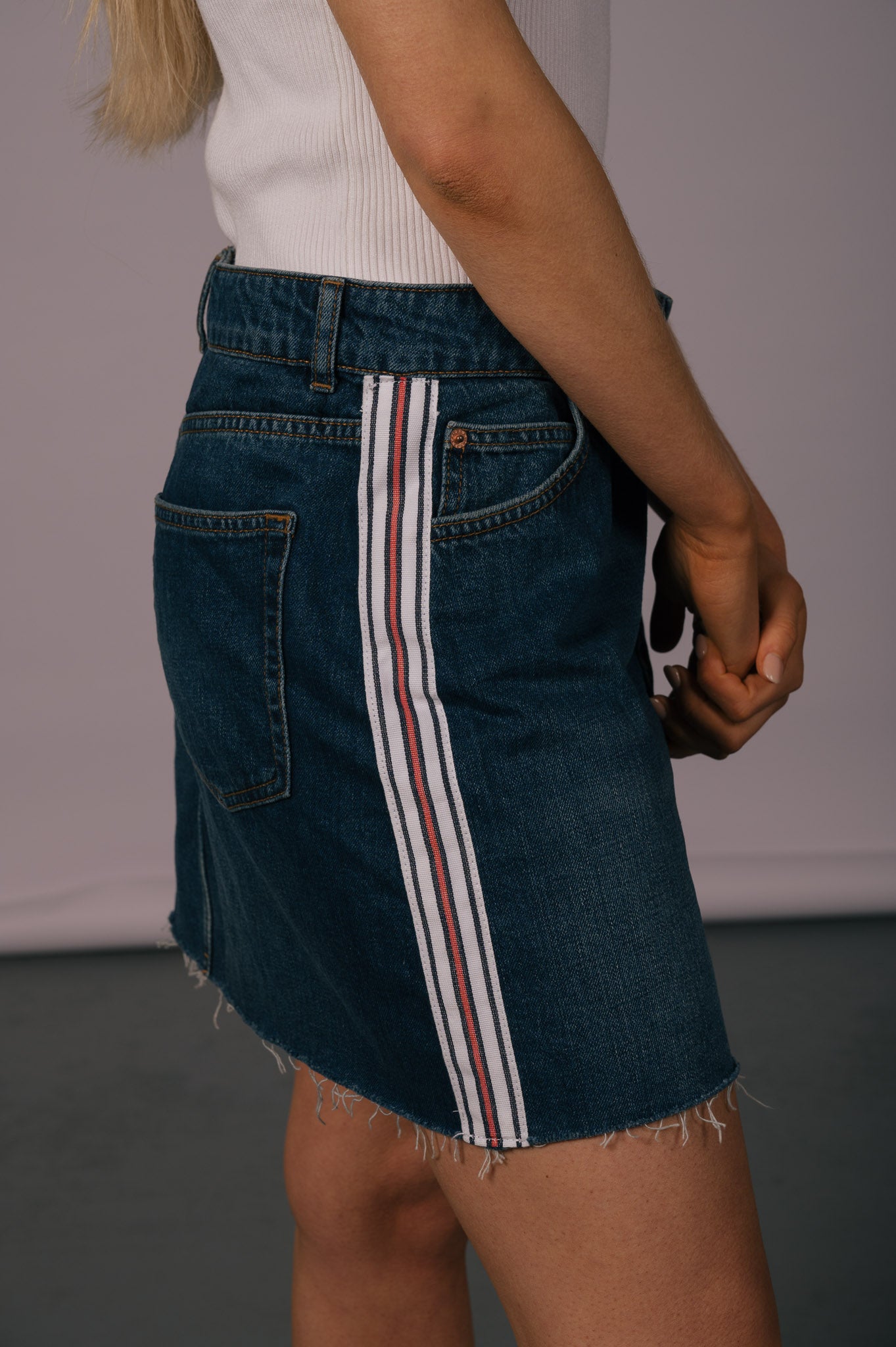 Vintage denim mini skirt with frayed edges  close up - Lemon Lane Vintage