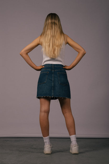 Vintage denim mini skirt with frayed edges  back view - Lemon Lane Vintage