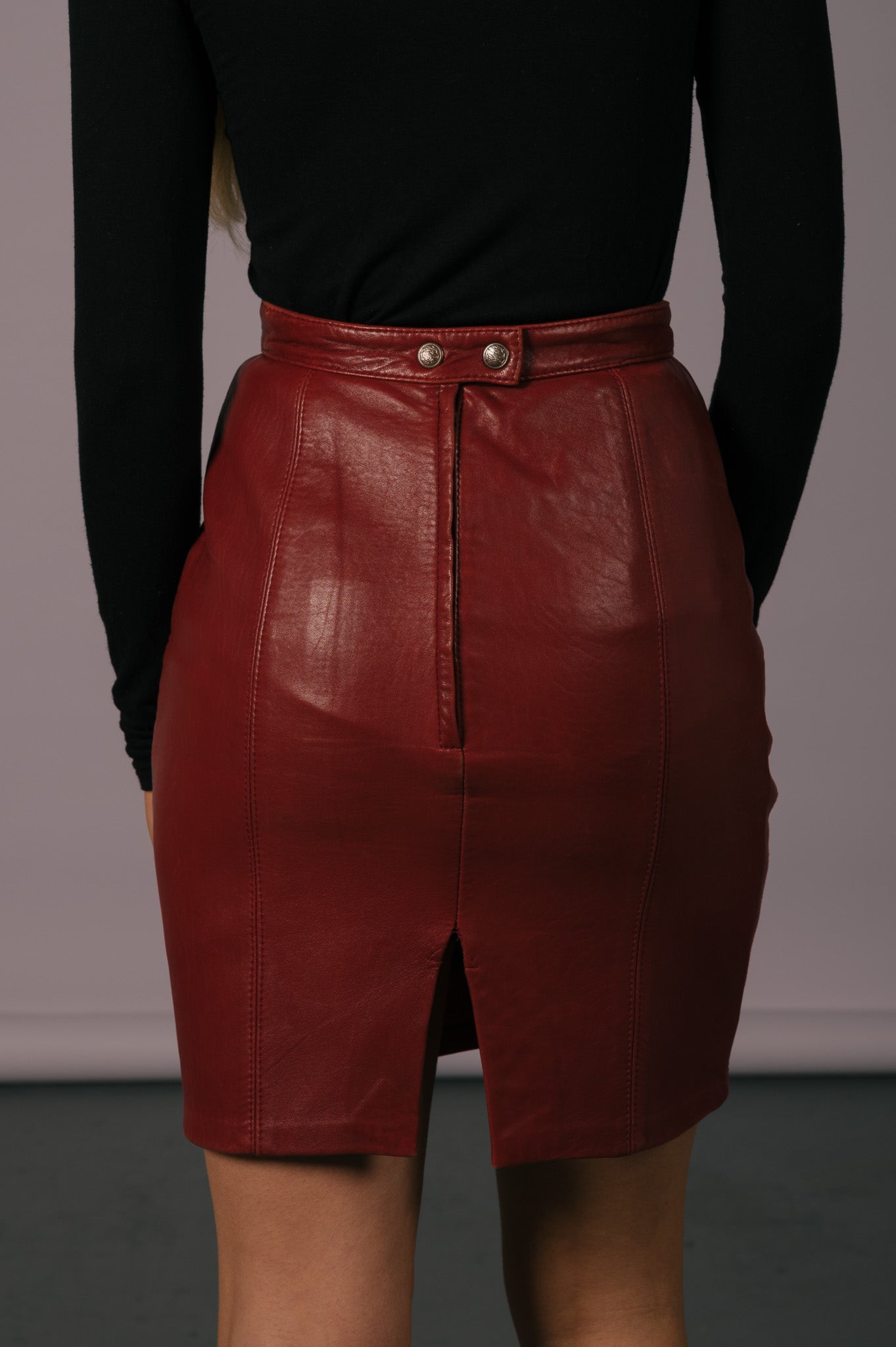 Vintage burgundy red leather mini skirt back view - Lemon Lane Vintage