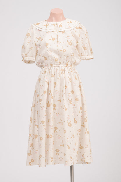 Close-up of layered Peter Pan collar on vintage floral dress.