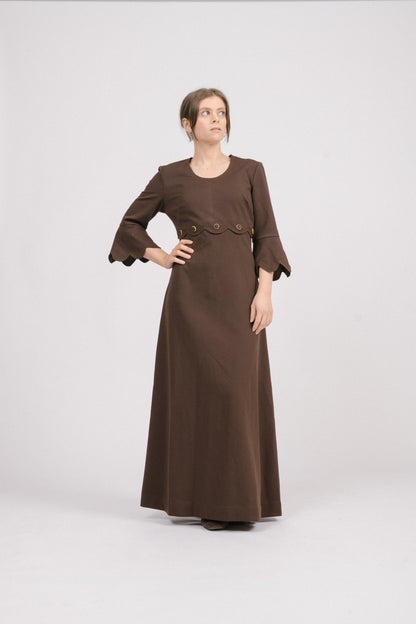 Vintage 1970s brown fit-and-flare maxi dress with scallop trim sleeves.