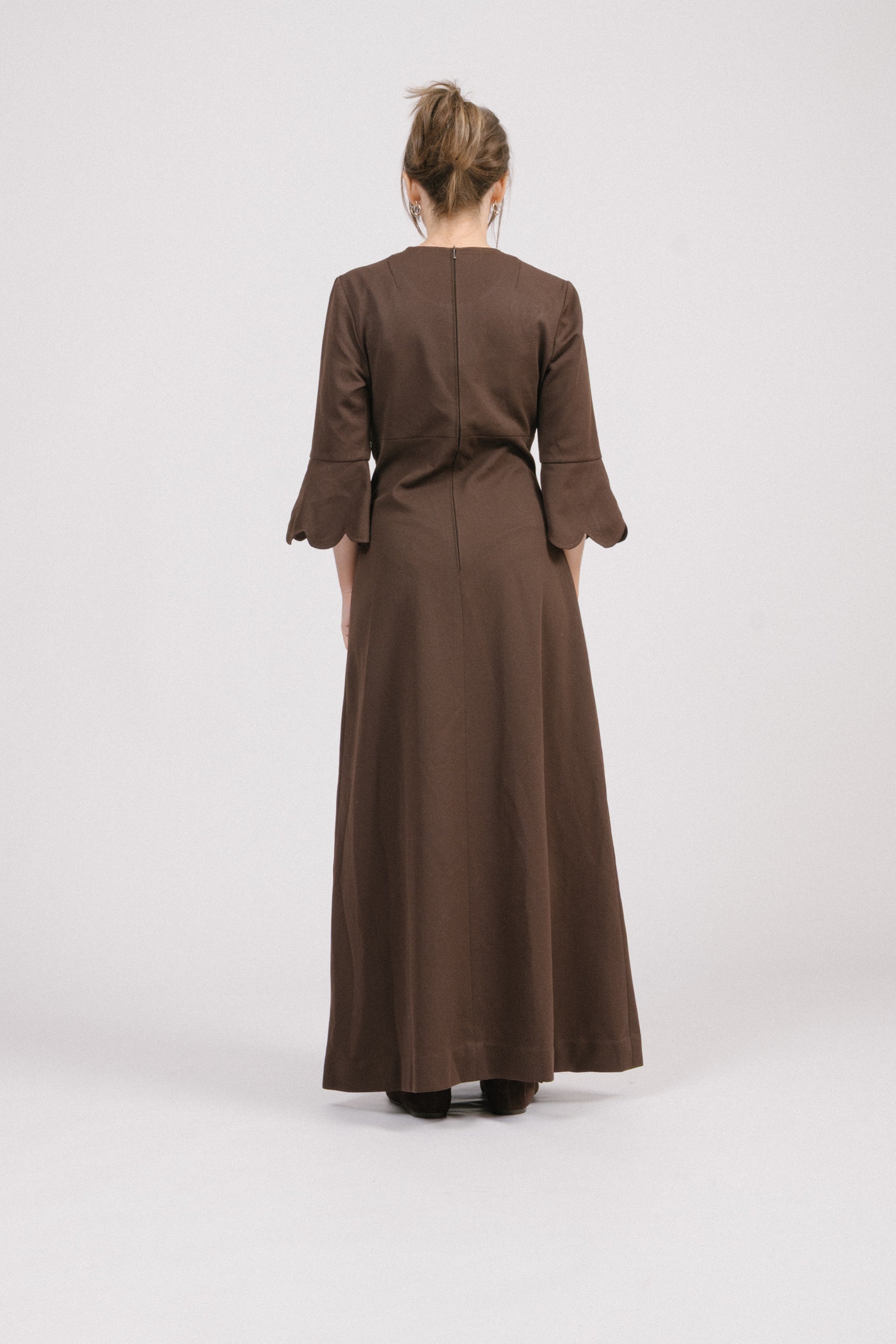 Back view of vintage brown 1970s maxi dress with invisible zip.