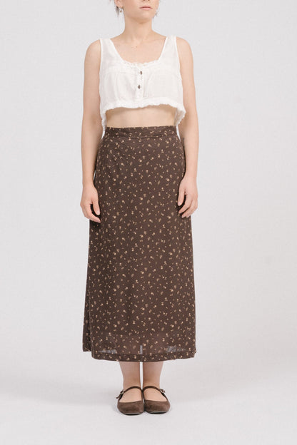 Front view of vintage brown floral midi skirt with beige and light brown florals, straight silhouette, and satin lining. Timeless heirloom-style vintage clothing Australia.
