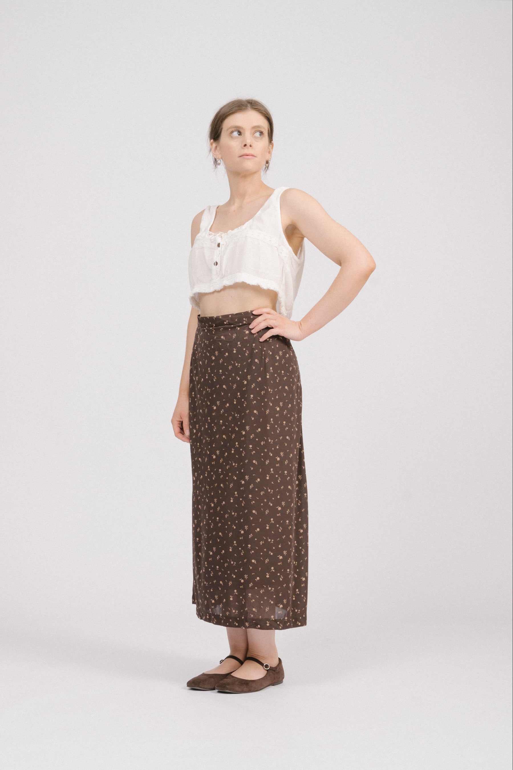 Side view of vintage brown floral midi skirt with invisible side zipper, metal snap closure, and relaxed midi fit. Soft heirloom-inspired vintage clothing Australia.