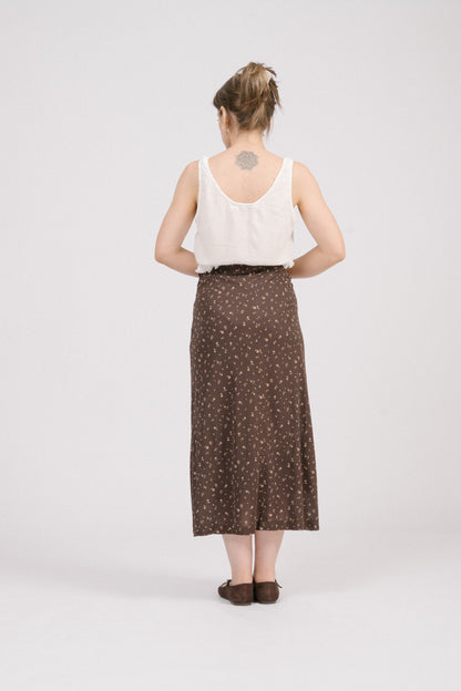 Back view of vintage brown floral midi skirt showing clean lines and straight cut. Feminine and timeless vintage piece for cottagecore wardrobes.