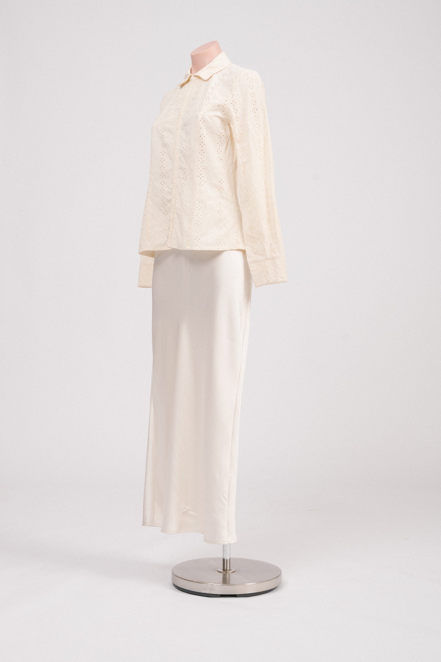 Side view of vintage floral embroidered blouse with long sleeves and hook-and-eye closure, showing soft structured fit. Heirloom-inspired vintage clothing Australia.