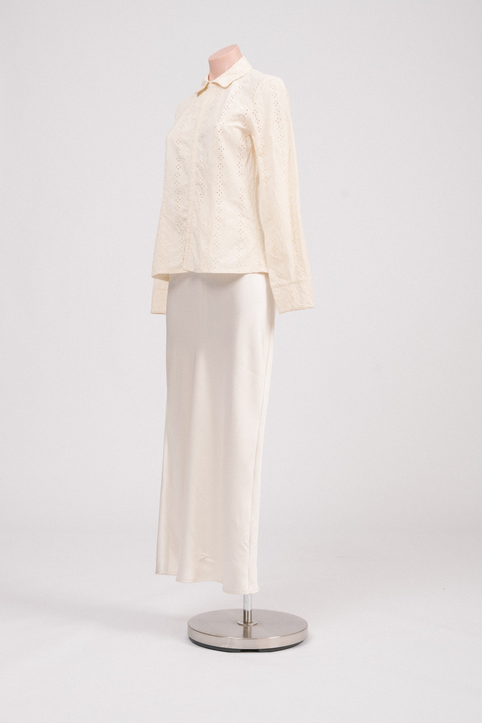 Side view of vintage floral embroidered blouse with long sleeves and hook-and-eye closure, showing soft structured fit. Heirloom-inspired vintage clothing Australia.
