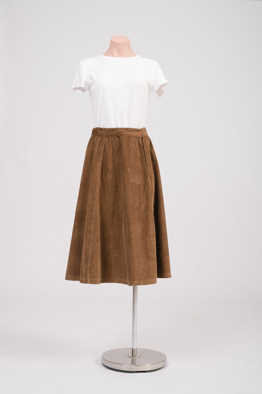 Front view of vintage brown cotton corduroy A-line midi skirt with side button closure. Timeless vintage clothing Australia.
