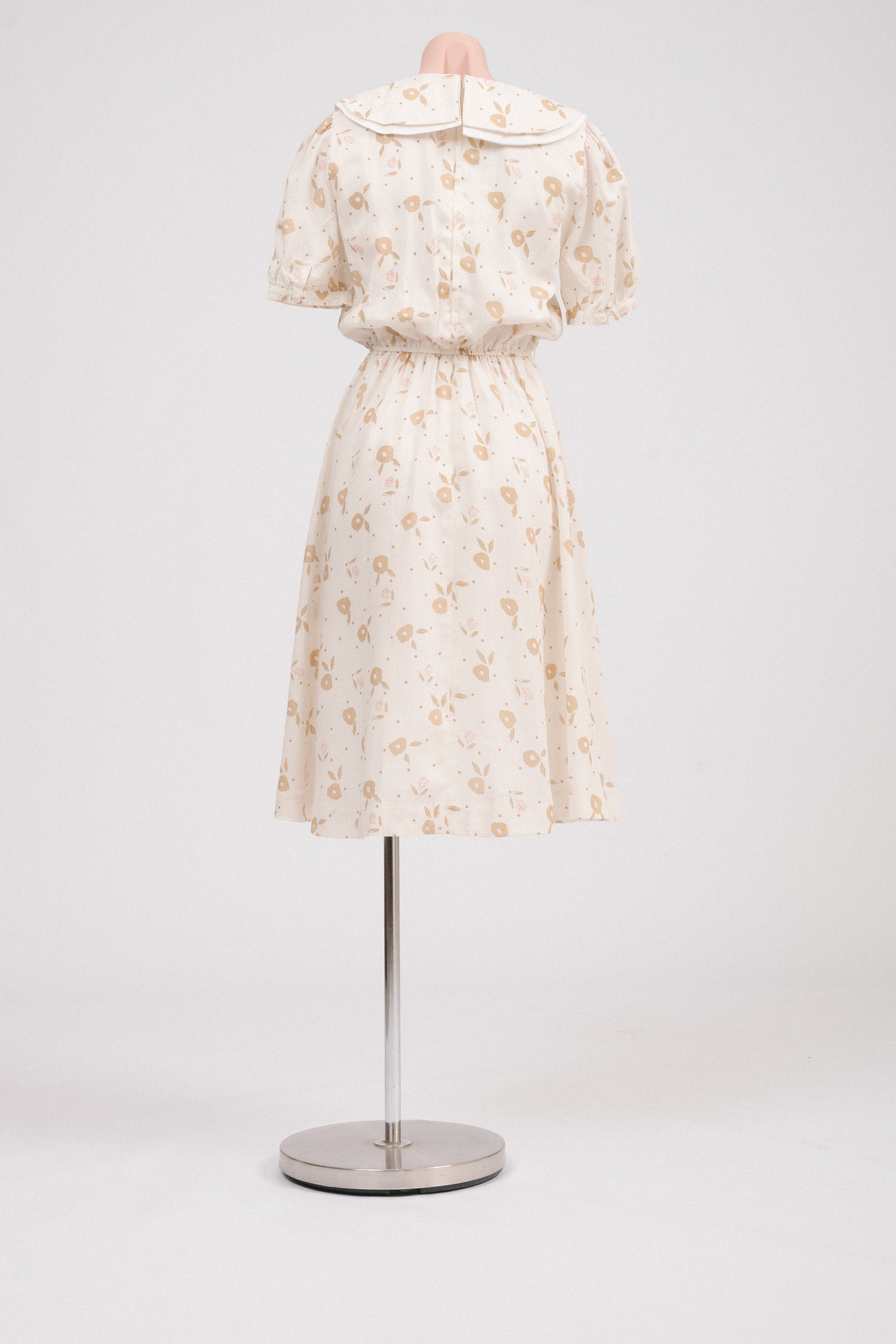 Back view showing lapped metal zipper on vintage floral midi dress.