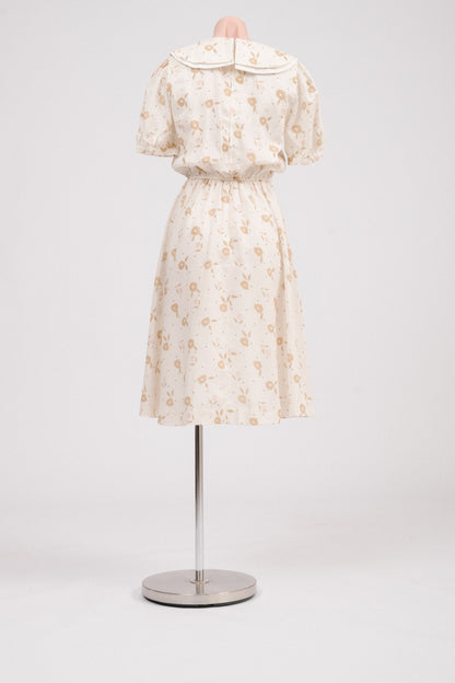 Back view showing lapped metal zipper on vintage floral midi dress.