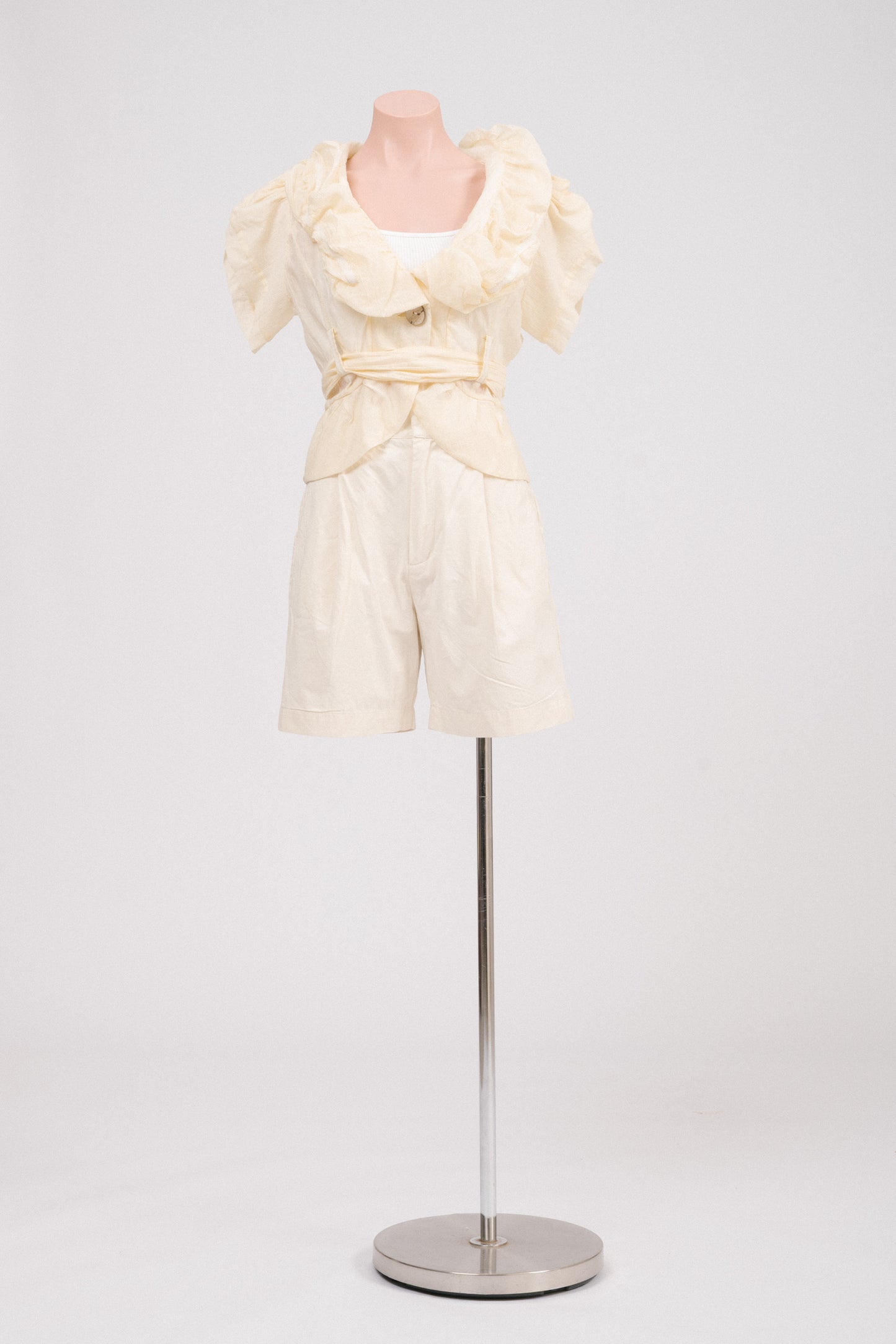 Front view of buttercream tailored preloved cotton shorts by Incu Collection.