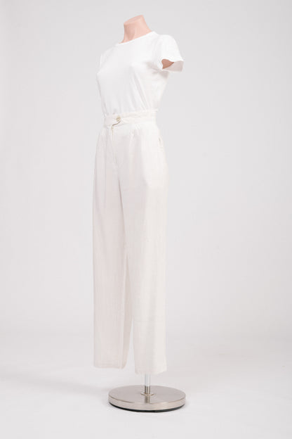 Side view of striped tailored pants highlighting pocket detail.