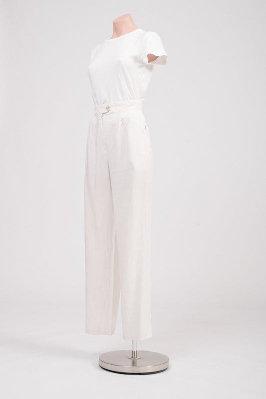 Side view of striped tailored pants highlighting pocket detail.