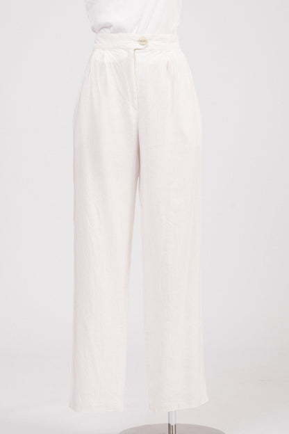 Close-up of waistband showing lapped zipper fly and textured button.