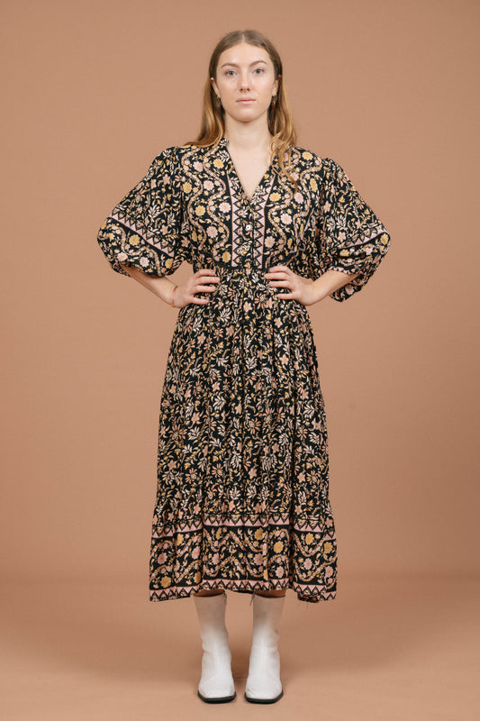 Vintage black floral midi dress with puffy sleeves and front buttons front view - Lemon Lane Vintage
