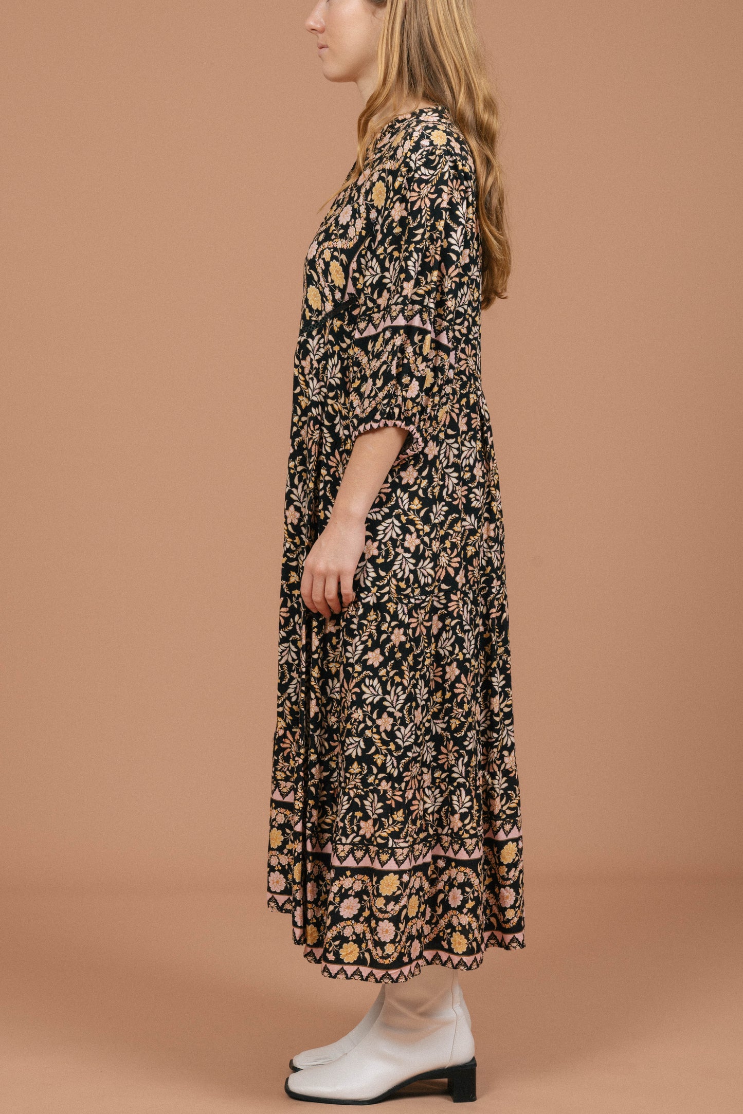 Vintage black floral midi dress with puffy sleeves and front buttons side view - Lemon Lane Vintage