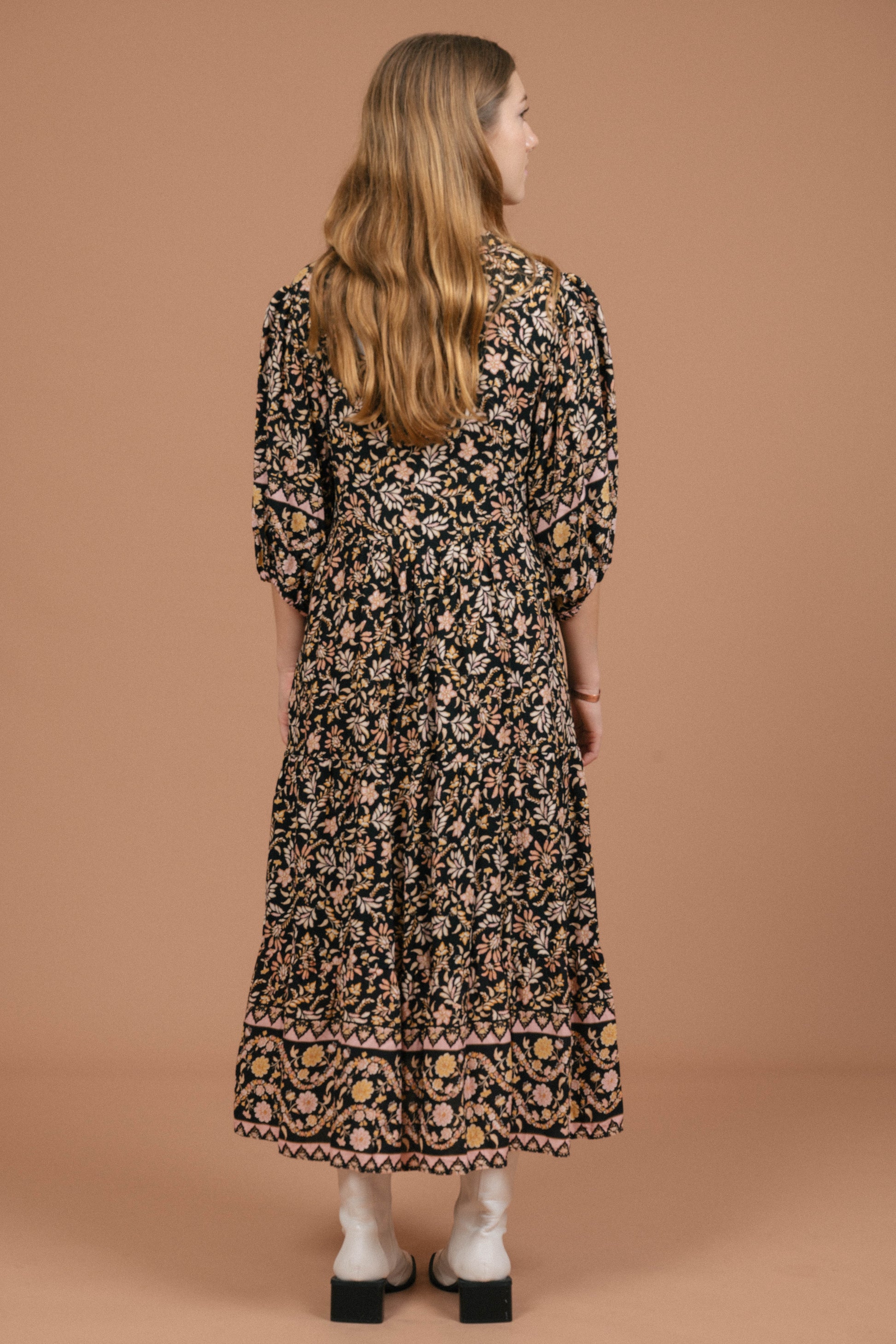 Vintage black floral midi dress with puffy sleeves and front buttons back view - Lemon Lane Vintage