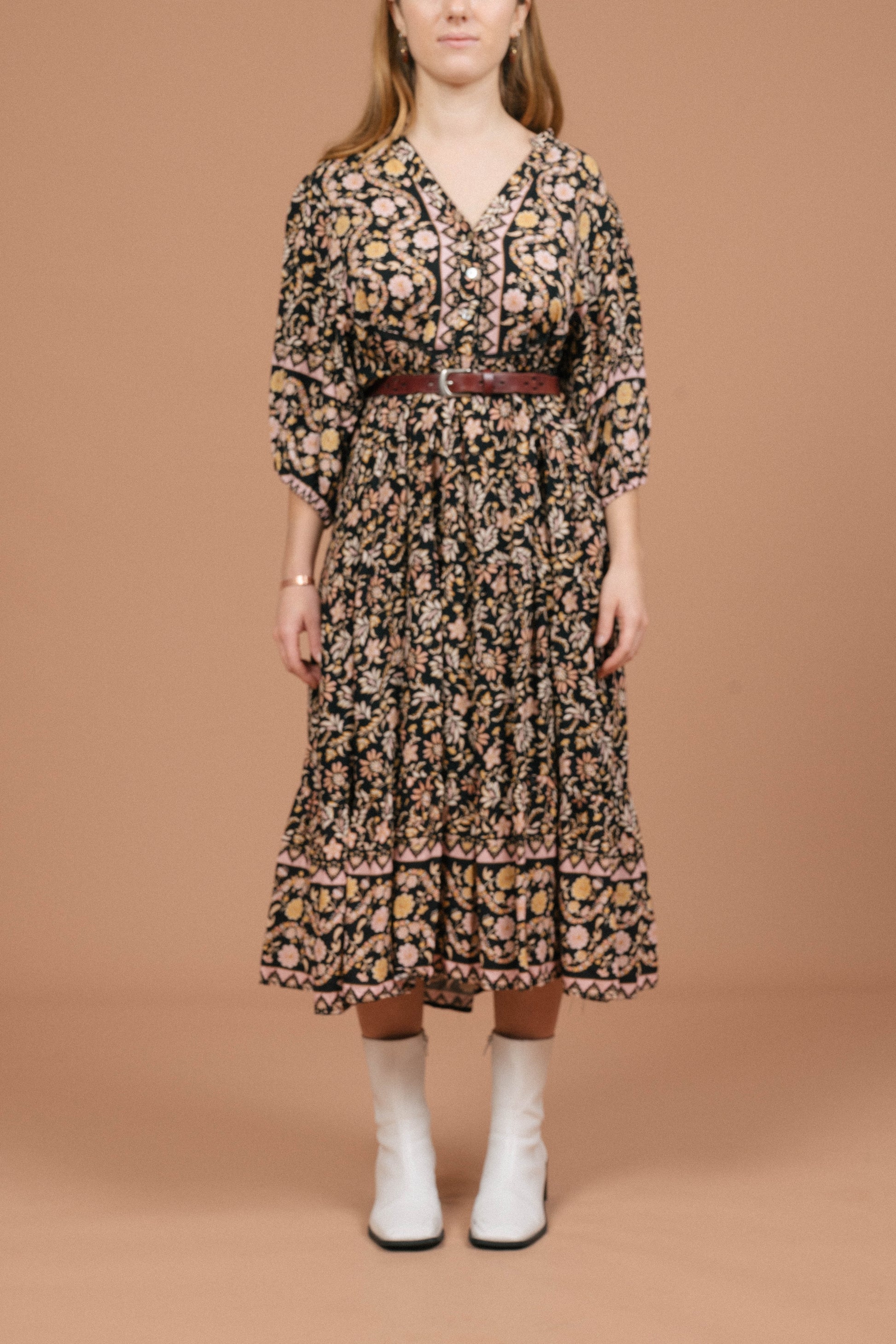 Vintage black floral midi dress with puffy sleeves and front buttons front view - Lemon Lane Vintage