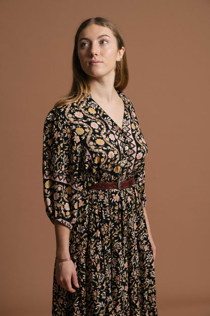 Vintage black floral midi dress floral pattern, fabric texture, and front button detail - Lemon Lane Vintage
