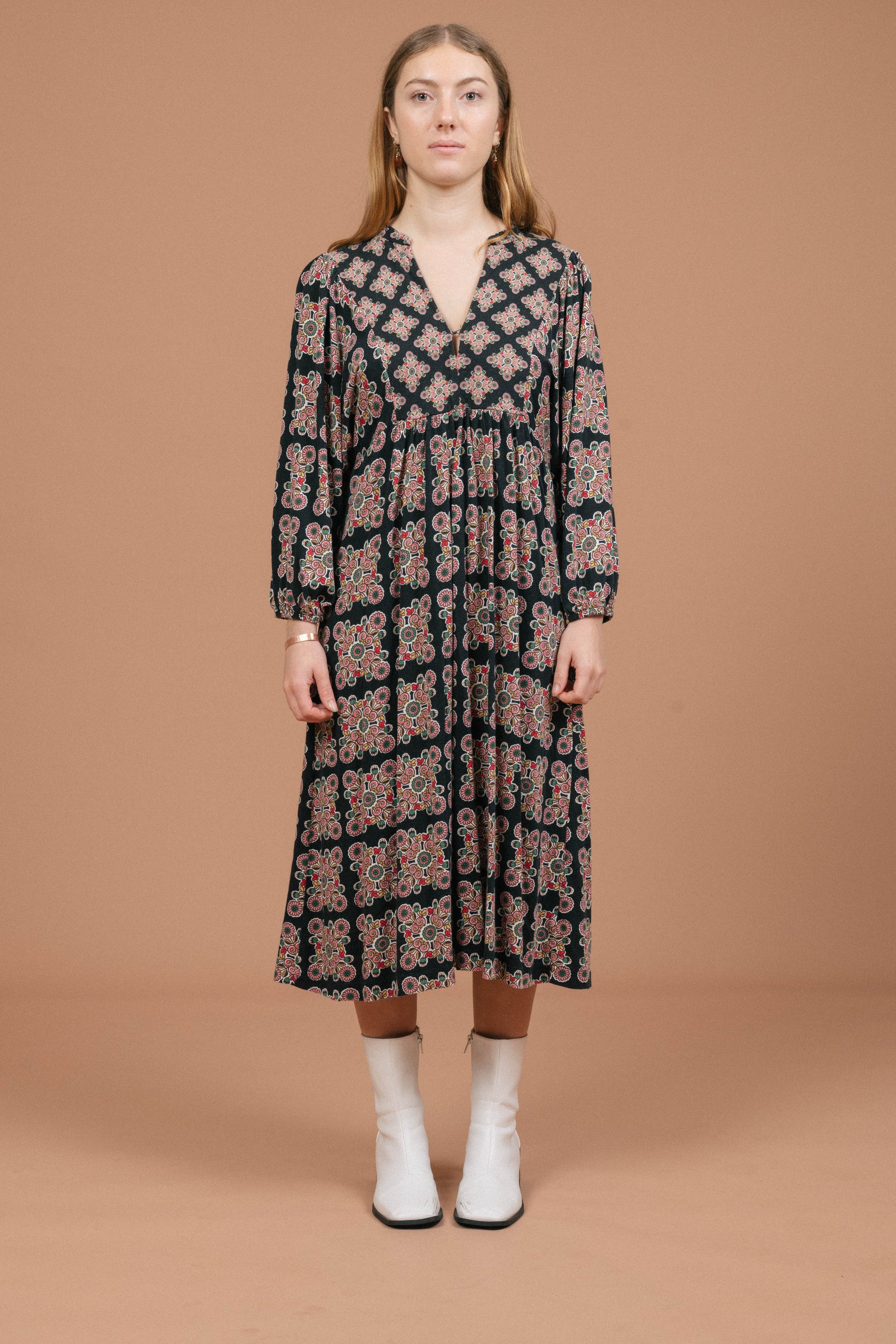 Vintage long sleeved black and multi-coloured maxi dress with geometric pattern front view - Lemon Lane Vintage