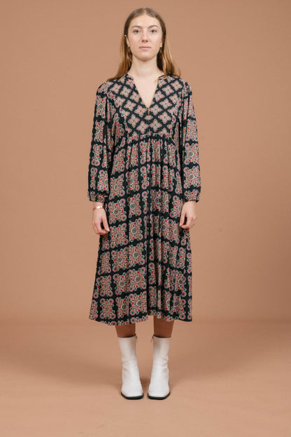 Vintage long sleeved black and multi-coloured maxi dress with geometric pattern front view - Lemon Lane Vintage