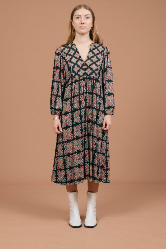 Vintage long sleeved black and multi-coloured maxi dress with geometric pattern front view - Lemon Lane Vintage